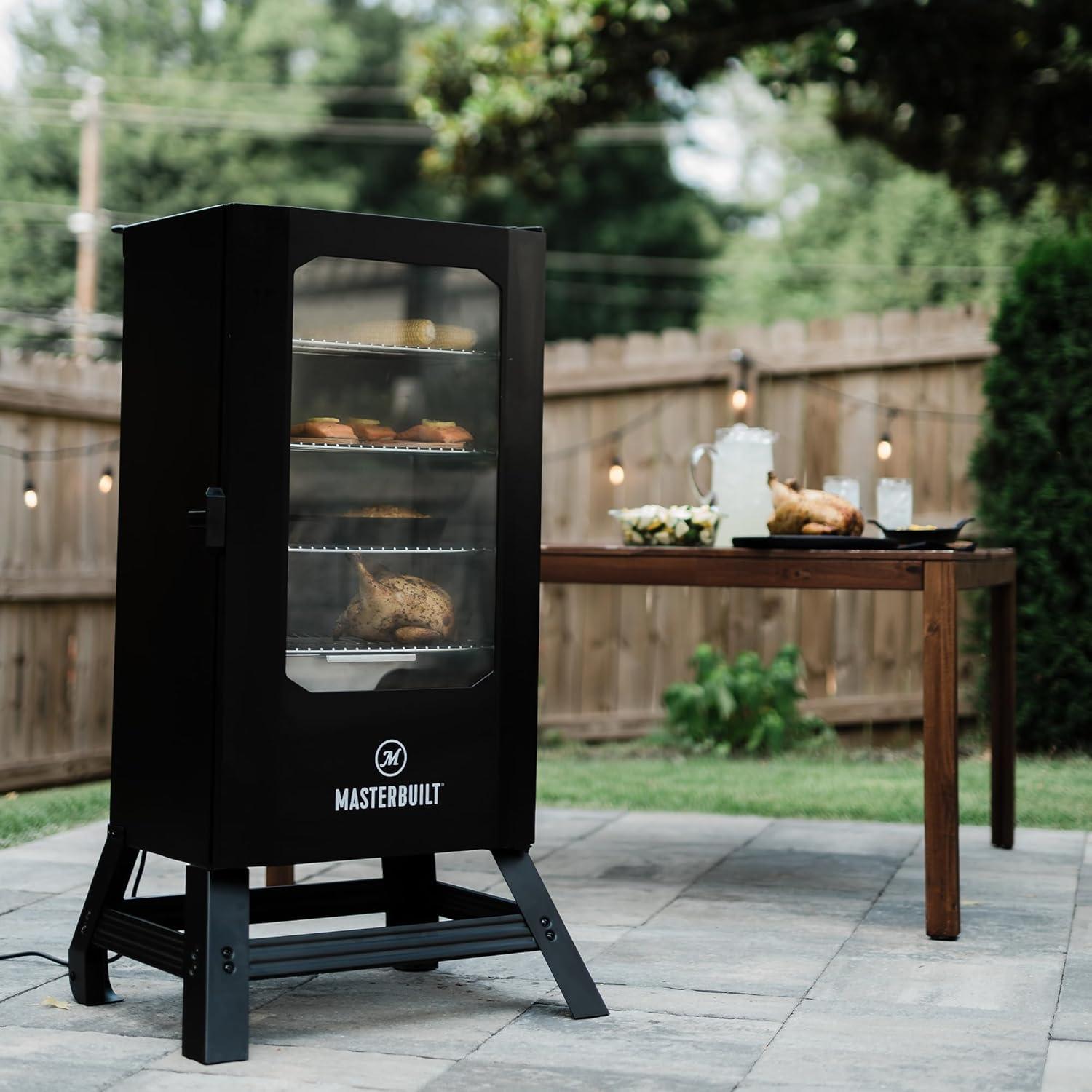 imageMasterbuilt 40inch Digital Electric Vertical BBQ Smoker with Side Wood Chip Loader Chrome Smoking Racks and 970 Cooking Square Inches in Black Model MB2007291830inch Digital with Window Legs