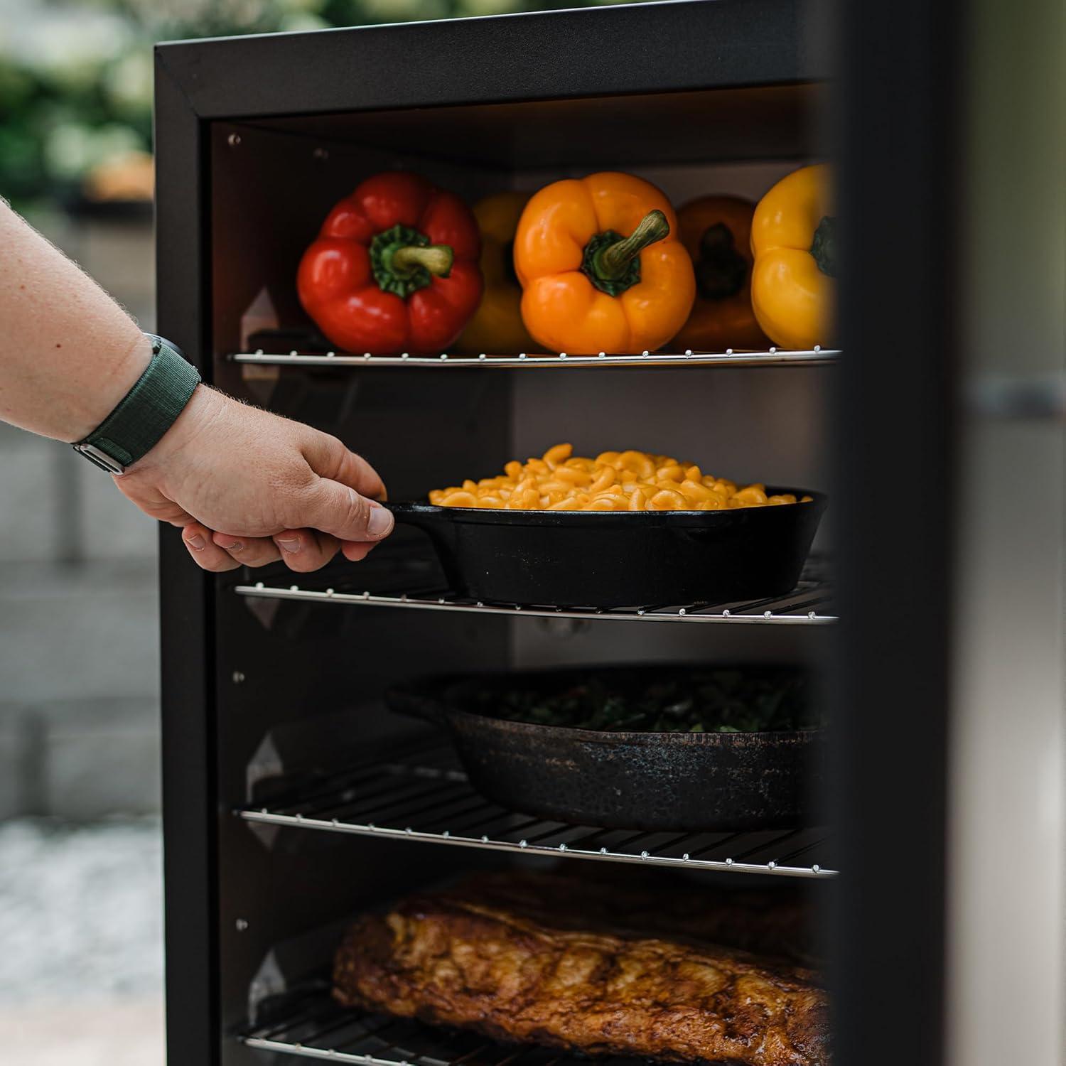 imageMasterbuilt 40inch Digital Electric Vertical BBQ Smoker with Side Wood Chip Loader Chrome Smoking Racks and 970 Cooking Square Inches in Black Model MB2007291830 No Window